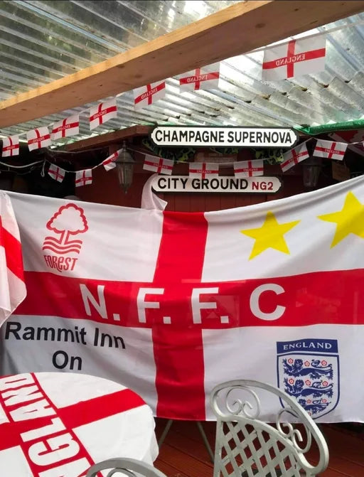 Nottingham Forest and England flag displayed beneath a City Ground sign