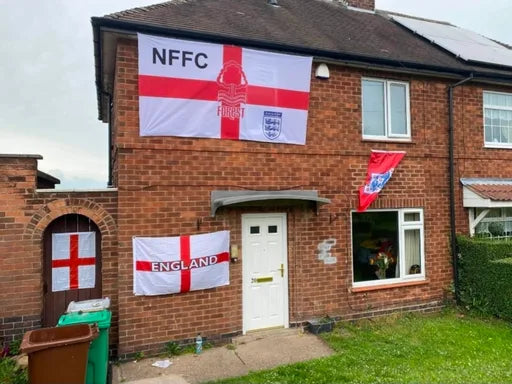 Large Nottingham Forest and England flag displayed on a house