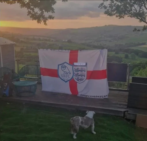 Finished England flag with Sheffield Wednesday crest displayed in a garden