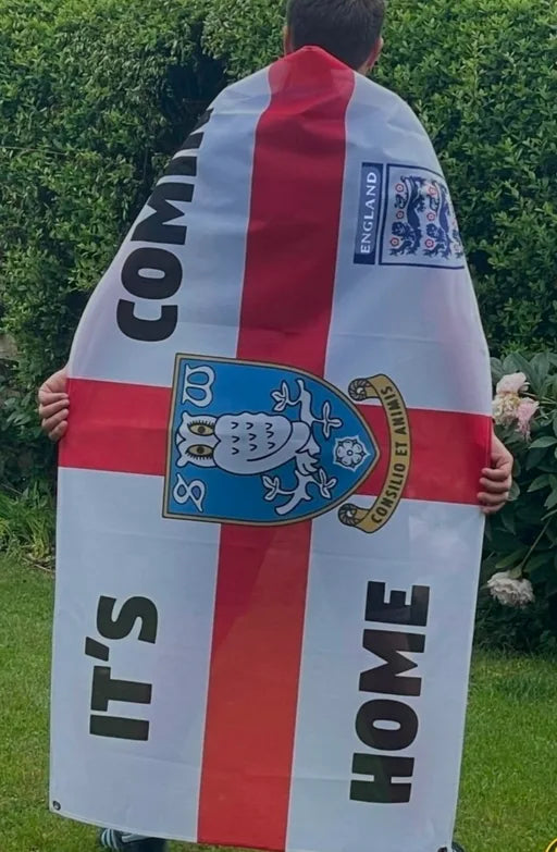 Supporter wearing a personalised Sheffield Wednesday and England flag