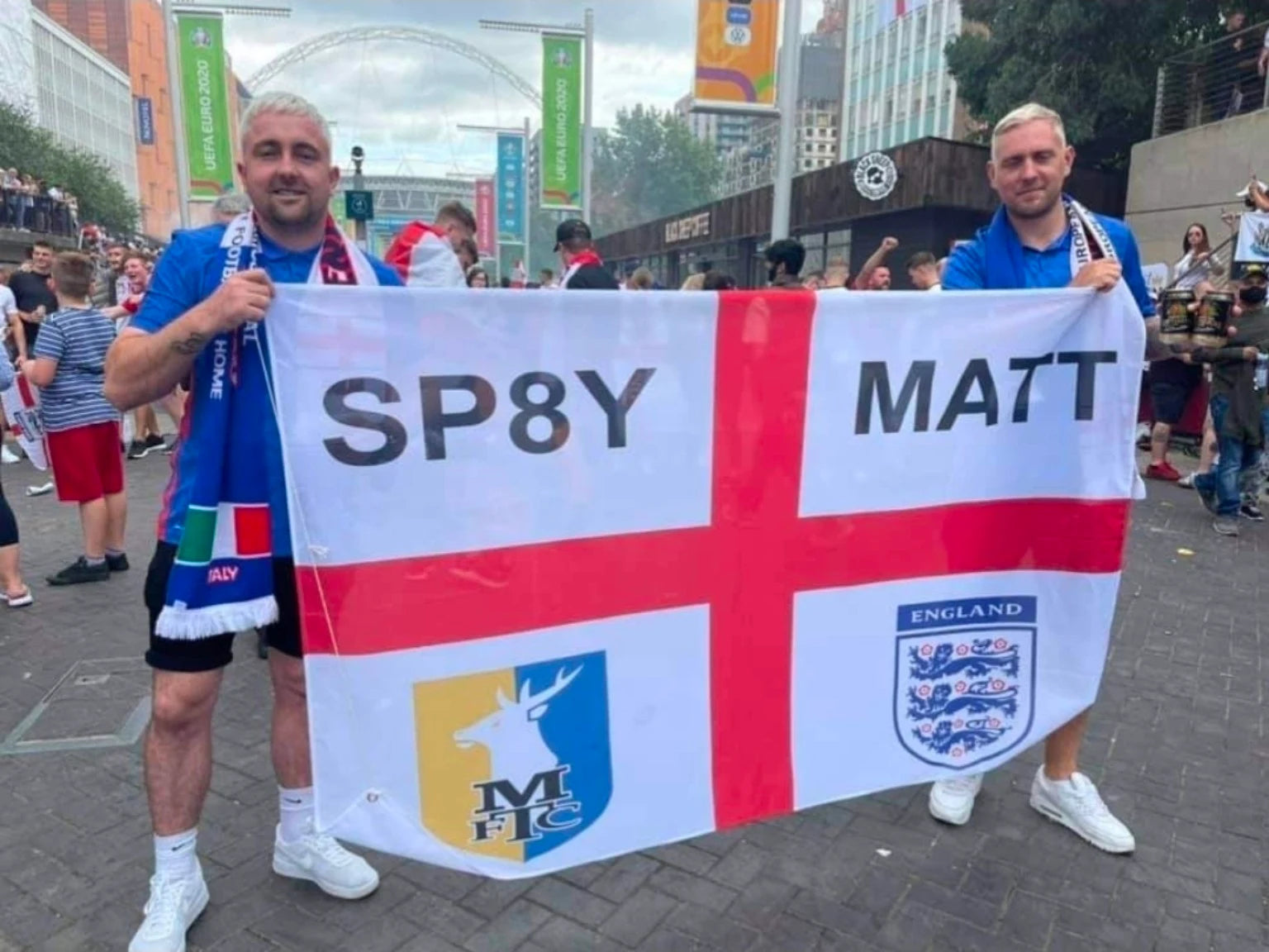 Supporters holding a personalised Mansfield Town and England flag at Wembley